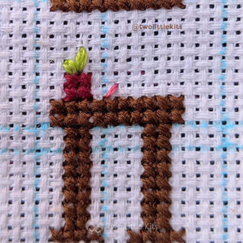 The first half of the first cross-stitch