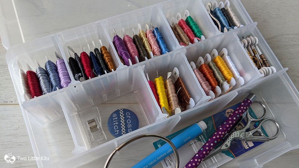 A cute, organised box of embroidery floss and accompanying supplies