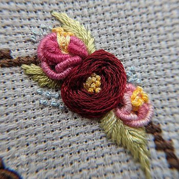 Gorgeous embroidered flowers using woven wheel and bullion stitches