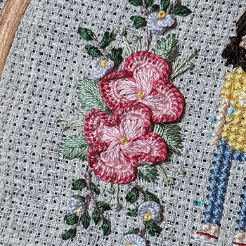 A work-in-progress of a 'semi-secret' stitch people gift I'm working on, where I've been doing hand embroidered florals on it.