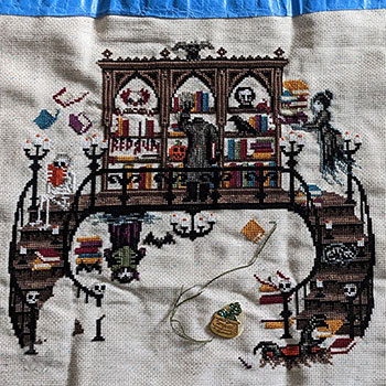 The entire progress of the Haunted Library stitch-along.