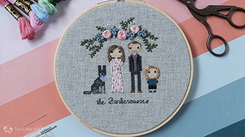 A cross-stitch and hand embroidered stitch people family of a man, woman, daughter and dog.