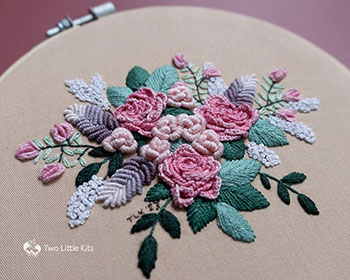 The lighting on this close-up photo to the embroidery shows how intricate, detailed and 3D the piece is.