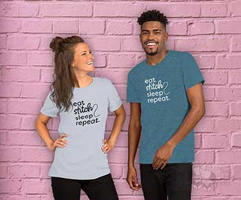 A photo of two models wearing the same t-shirt design; one in light blue and the other in teal. The design reads *Eat Stitch Sleep Repeat*.